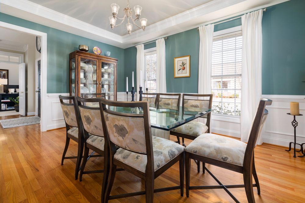 A dining room with a warm oak strip floor in a South End Halifax home.