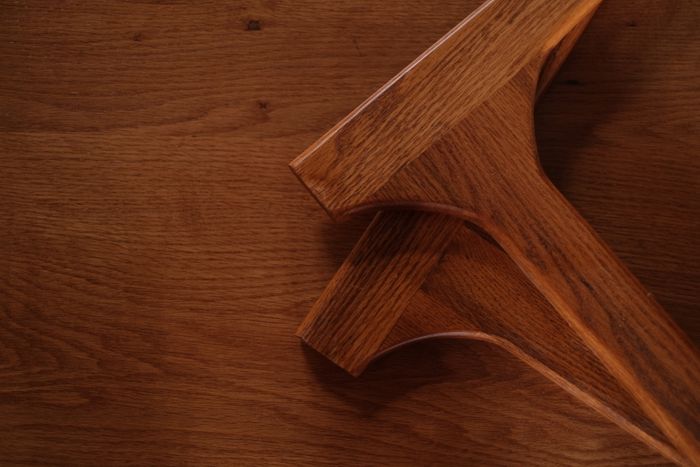 Close detail of stained oak grain under a satin finish.